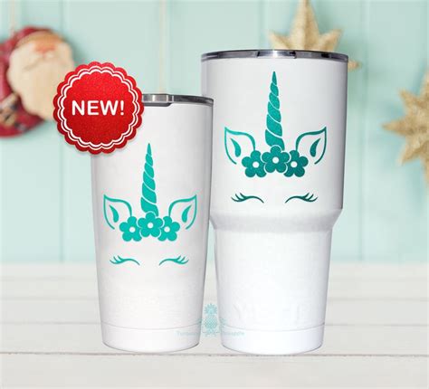 Two White Tumblers With Green Unicorns On Them One Is Blue And The