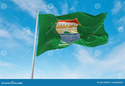 Official Flag Of Palembang City Indonesia At Cloudy Sky Background On