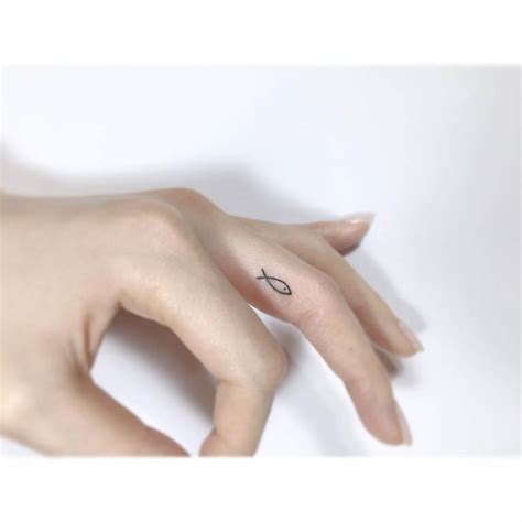 Tiny Minimalistic Jesus Fish Tattoo Located On