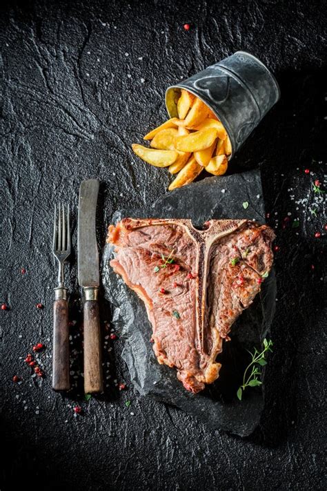 Fresh Tbone Steak And Chips On The Black Rock Stock Image Image Of Potato Closeup 88989149