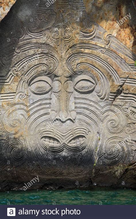 Mine Bay Maori rock carving of Ngatoroirangi Stock Photo - Alamy