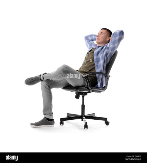 Young Man Relaxing On Chair Against White Background Stock Photo Alamy