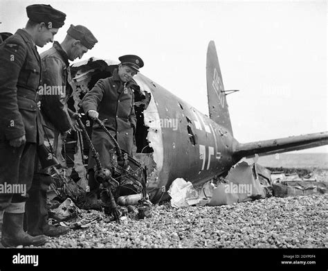 Soldiers Looking At The Machine Guns Of A Shot Down Heinkel He 111