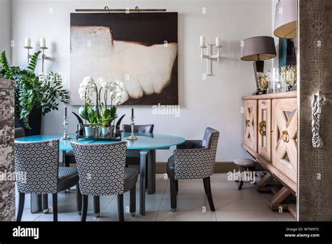 Contemporary Dining Room With Patterned Chairs Stock Photo Alamy