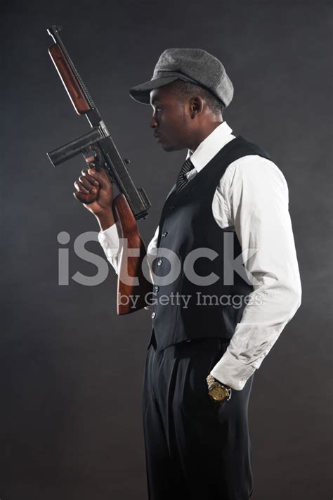 Black American Mafia Gangster Man In Suit With Gun Stock Photo