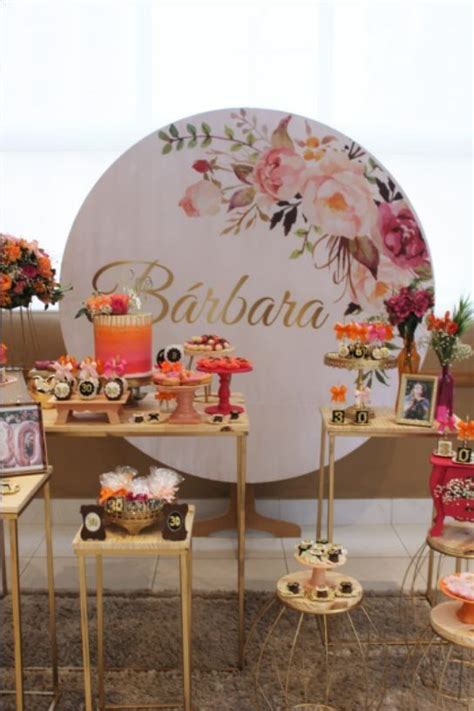 The Dessert Table Is Decorated With Flowers And Candles