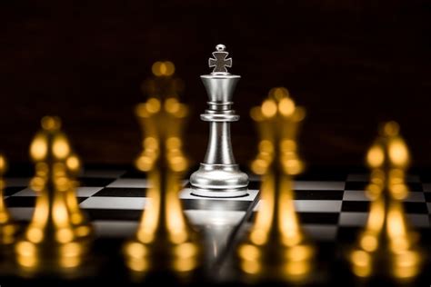 Premium Photo Single Silver King Chess Surrounded By A Number Of Gold