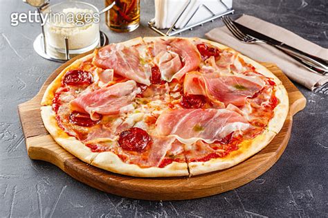 Pizza With Salami And Prosciutto