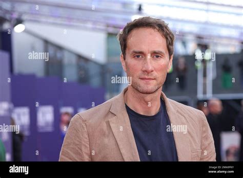 Oliver Chris Poses For Photographers Upon Arrival For The Premiere Of