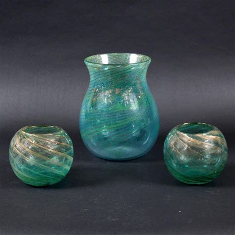 Large Monart Art Glass Vase A Large Green Glass Vase With A Swirling Design And Gold Coloured Infle