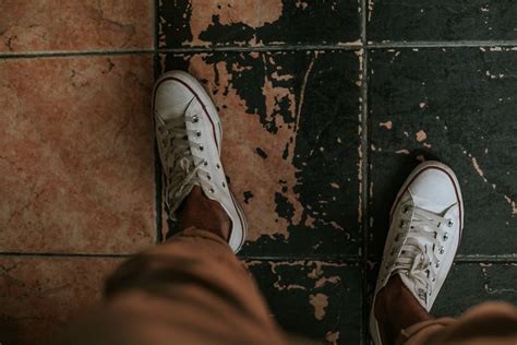 Person Walking Wearing Black Shoes In Grayscale Photography · Free