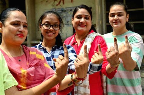 Women Voters Show Their Inked Marked Fingers After Casting Their Vote