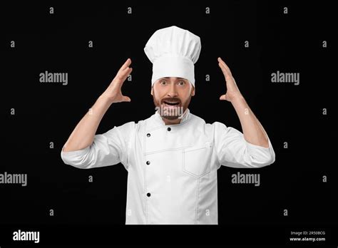 Emotional Mature Male Chef On Black Background Stock Photo Alamy