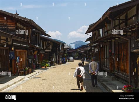 Visitors Stroll Along The Main Street In Narai A Post Town On The