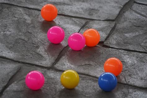 Premium Photo | Colorful balls on the concrete floor