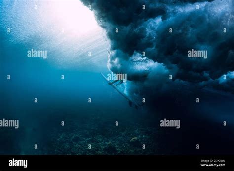 Surfer woman dive underwater with surfboard under powerful wave Stock Photo - Alamy