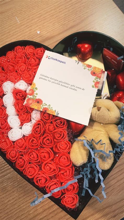 A Heart Shaped Box Filled With Roses And Teddy Bears