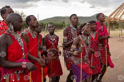 Masai In Traditional Colorful Clothing Showing Maasai Jumping Dance At