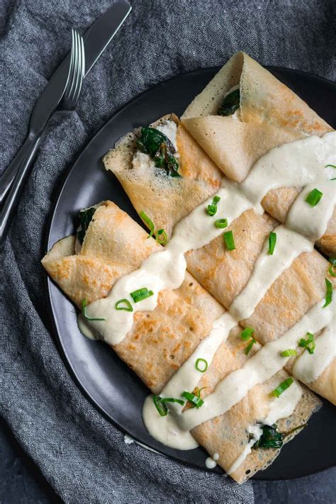 Savory Crepes with Almond Cheese Sautéed Spinach and Vegan Hollandaise