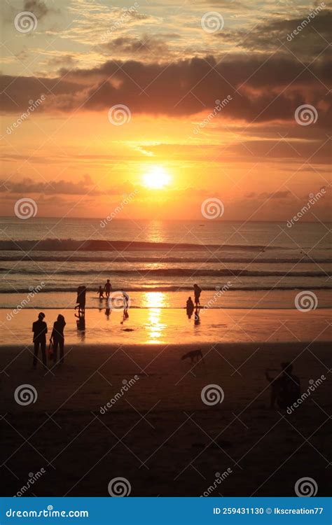 Cloudy Golden Sunset Light Reflection In Kuta Beach Bali Indonesia