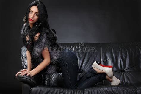 Beautiful Brunette Lying On A Leather Couch Stock Photo Image Of Erotic Interior