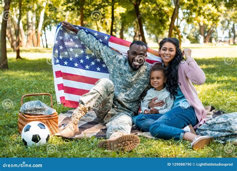 Happy African American Soldier In Military Uniform And Family Holding ...