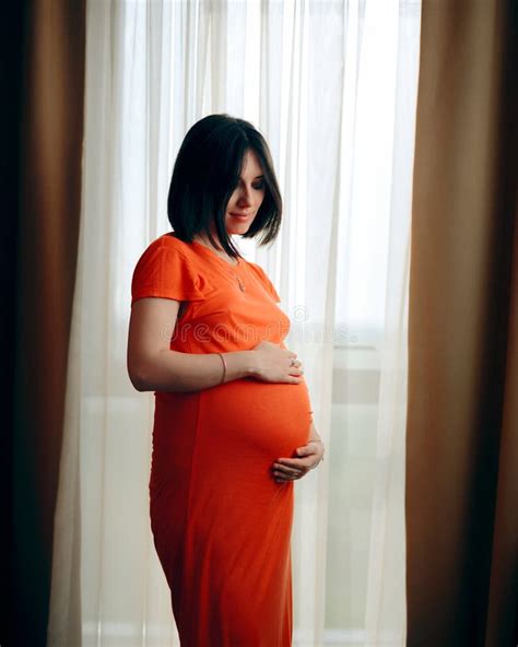 Portrait Of Pregnant Woman Standing In Front Of A Window Stock Image Image Of Health Awaiting