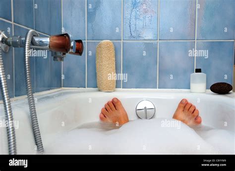 Bathtime Feet Sticking Out Of The Water At The End Of A Bath Stock