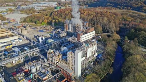 Aerial Footage Moving Towards A Large Industrial Chemical Plant In The