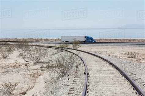 Semi Trick Driving Near Railroad Track Stock Photo Dissolve