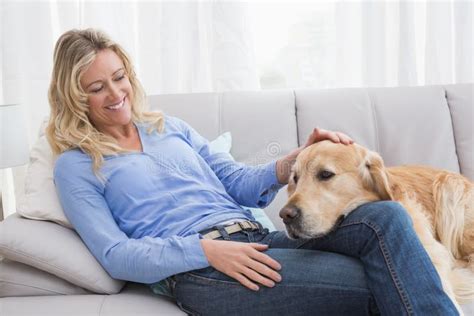 Smiling Blonde Woman Petting Her Golden Retriever Stock Image Image