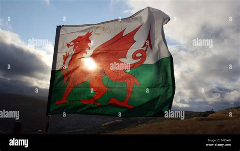 A Welsh Flag Flies High Above The Rhondda Valleys In Wales Stock Photo