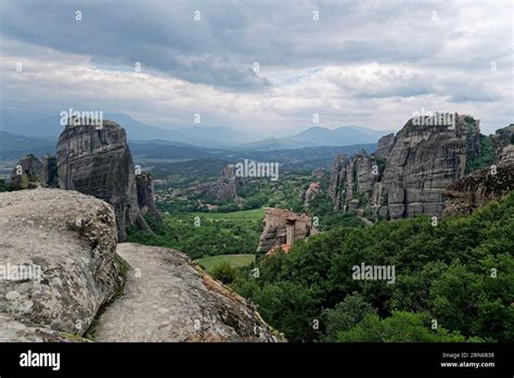 The Monastery Of Roussanou And Behind It The Monastery Of Agios