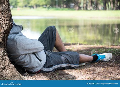 Asian Man Sleeping Under A Tree After Exercise Stock Image Image Of