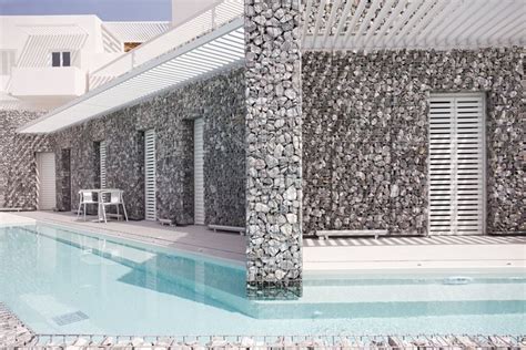 A Architecture Wraps Relux Hotel With Gabion Walls On Greek Island