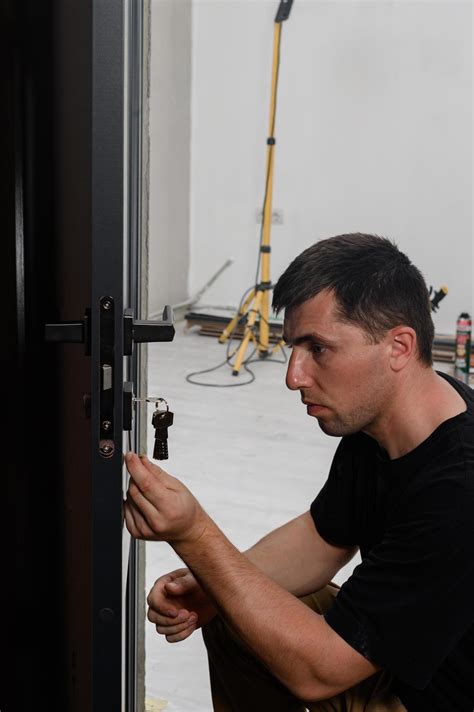 The technique of installing a door lock in an interior door. 14377819 Stock Photo at Vecteezy