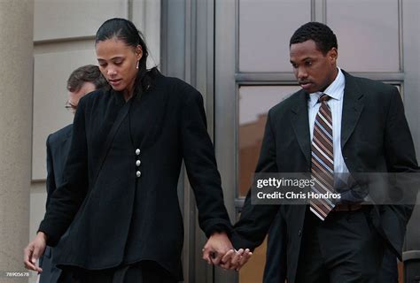 Marion Jones Walks With Her Husband Obadele Thompson After She Leaves