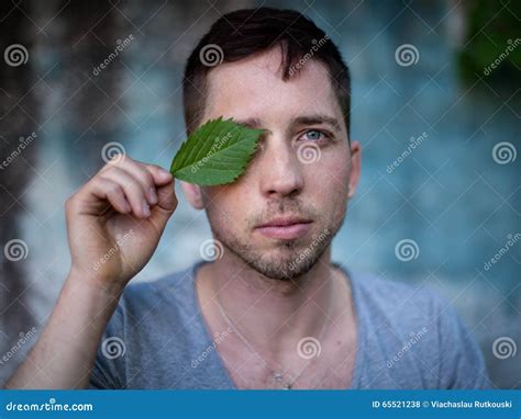 Portrait Of A Handsome Young Man With Closed Eyes On A Metallic Stock