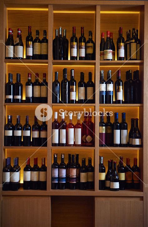 Wine Bottles On A Wooden Shelf In Modern Restaurant Interior Royalty Free Stock Image Storyblocks