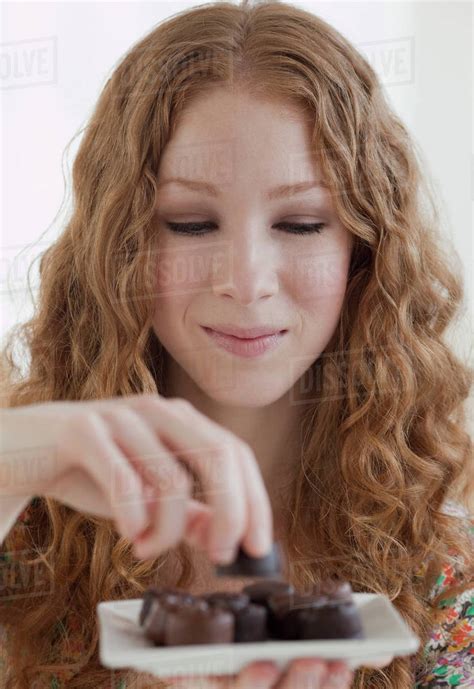 Woman Enjoying Snack Stock Photo Dissolve