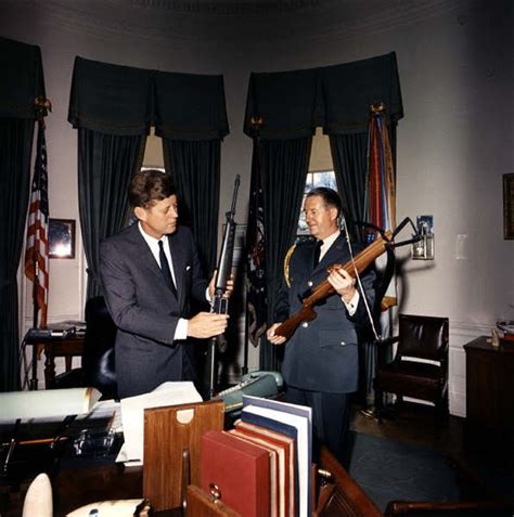 President John F Kennedy Holds An Ar 15 In The Oval Office With