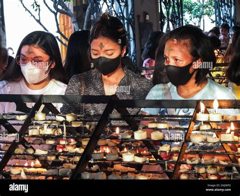 Catholic Devotees Seen Praying At The Candle Chapel Of The Baclaran