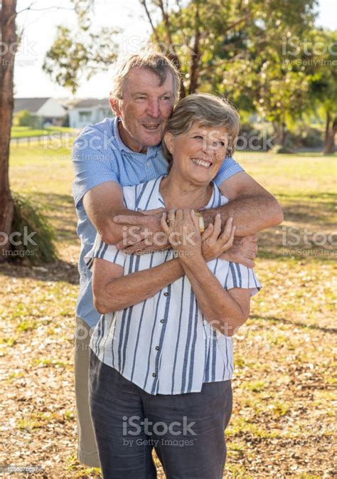 Portrait Of Caucasian Senior Couple In Their 70s Embracing Showing Love And Affection In The