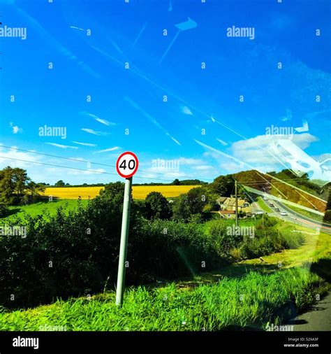 40 mph miles per hour speed limit sign on grass verge of roadway ...