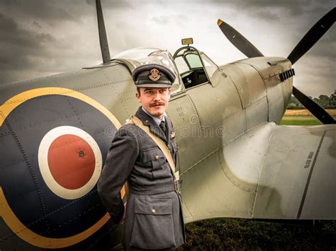 WW2 Flying Officer In Front Of Supermarine Spitfire From The Battle Of