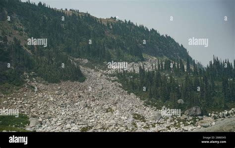 Canadian Mountain Range During A Forest Fire In British Columbia With