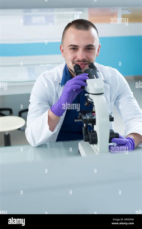 Portrait Of Caucasian Male Chemist Scientific Researcher Using