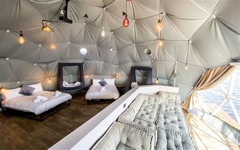 Escape To A Waterside Haven In These Stunning Glamping Domes Just A