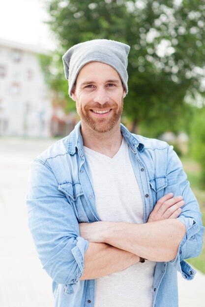 Premium Photo Portrait Of Smiling Man Standing Outdoors