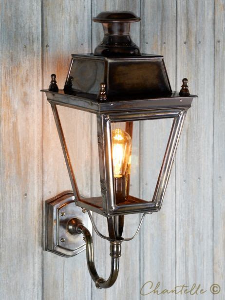 External Victorian Wall Light In An Antique Brass Finish With Glass Panels